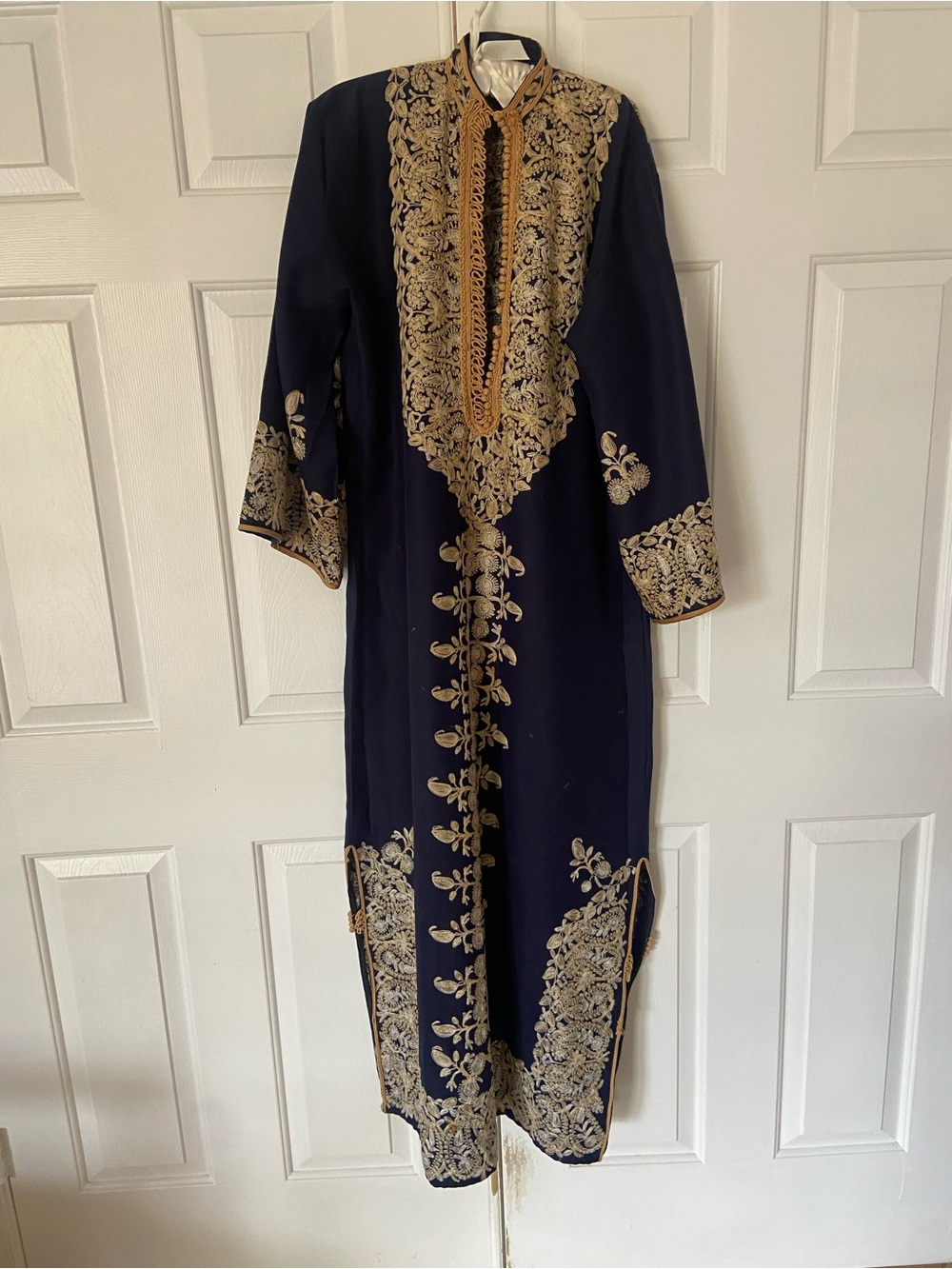 Long tunic , exquisitely embroidered in gold- wear it out ,  wear it home.